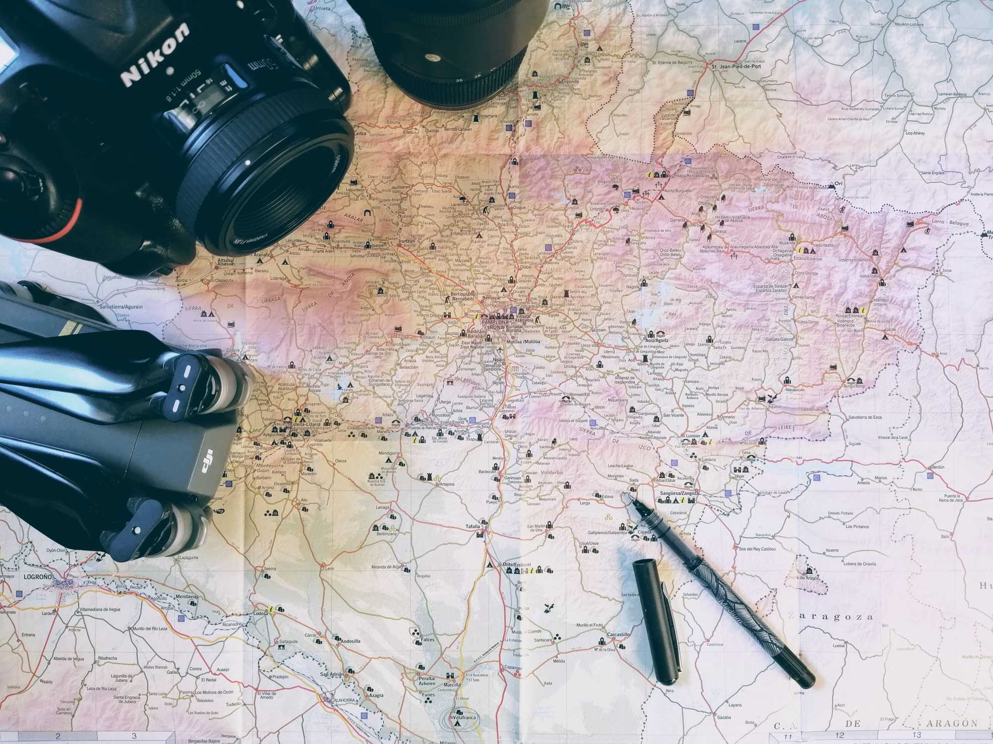 brown map and black Nikon camera